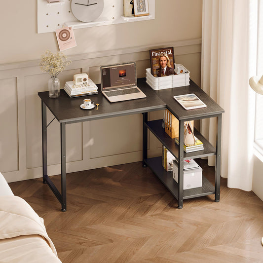 Black 100cm x 70cm small corner desk with side storage shelves, compact home office workstation in bedroom setup with laptop, books, and decor.