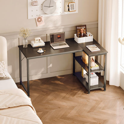 Black 120cm x 70cm corner desk with two-tier side shelves, modern home office desk for bedroom workspace with laptop, books, and decorative storage.