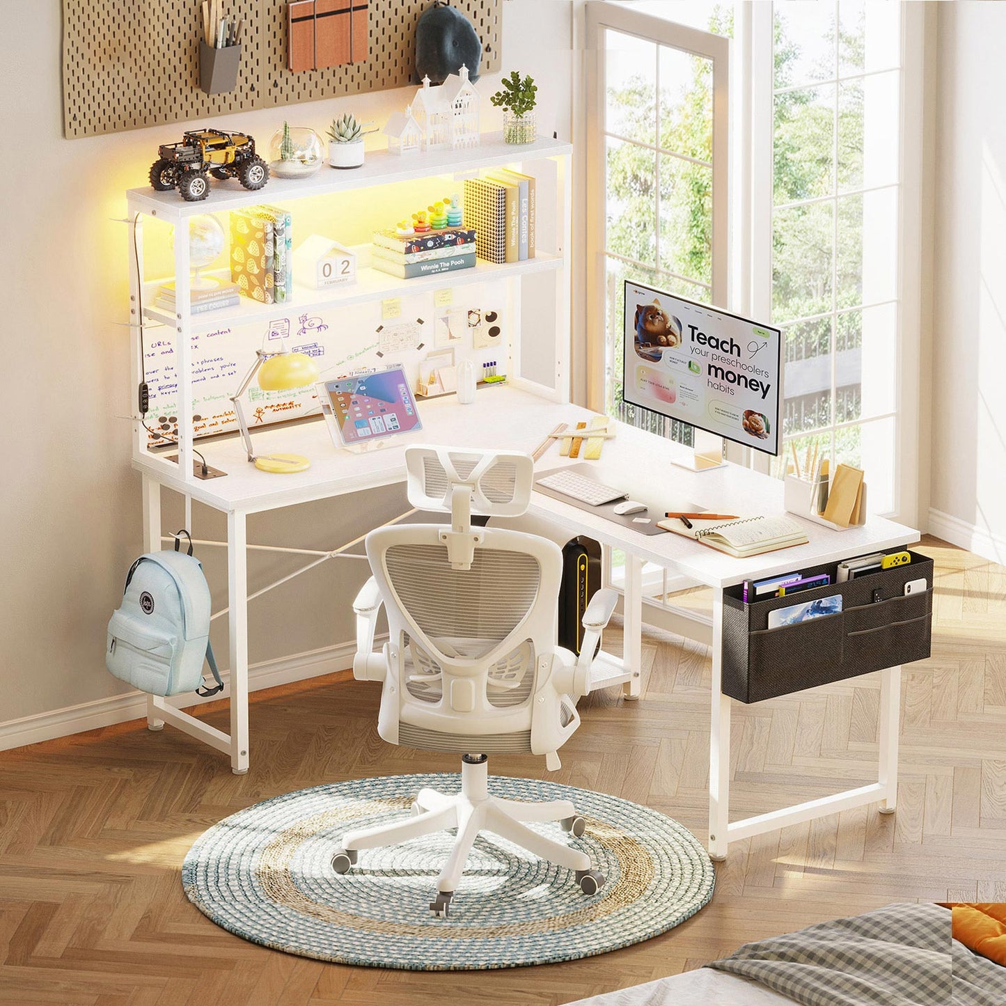 White 110cm x 80cm L-shaped desk with hutch shelves, LED light strip, and side hanging fabric file drawer, shown in a bright bedroom home office setup.