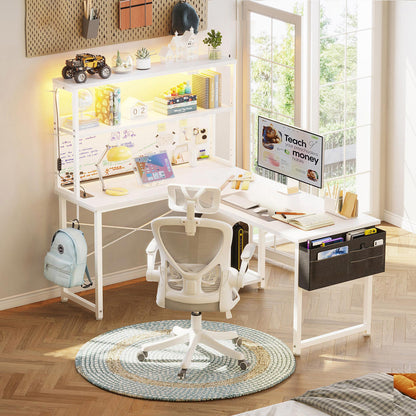 White 110cm x 80cm L-shaped desk with hutch shelves, LED light strip, and side hanging fabric file drawer, shown in a bright bedroom home office setup.