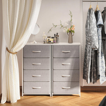 Two gray Coleshome 4-tier 4-drawer fabric dressers placed side by side in a bedroom closet scene, used as compact storage cabinets.