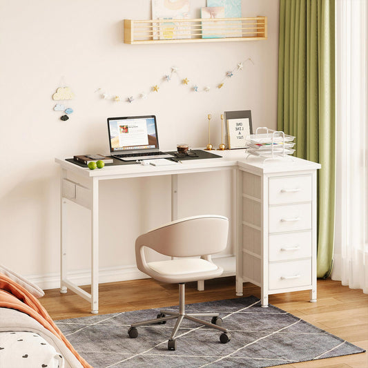 White 100cm x 70cm L-shaped desk with 4 fabric drawers in a bedroom study setup, featuring a right-side drawer cabinet, side storage pocket, and compact corner workspace design.