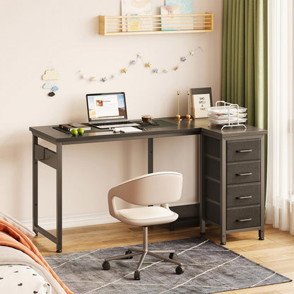 Black 120cm x 70cm L-shaped desk with 4 fabric drawers in a bedroom office setup, featuring an extended worktop, right-side storage drawers, and space-saving L-shaped design.