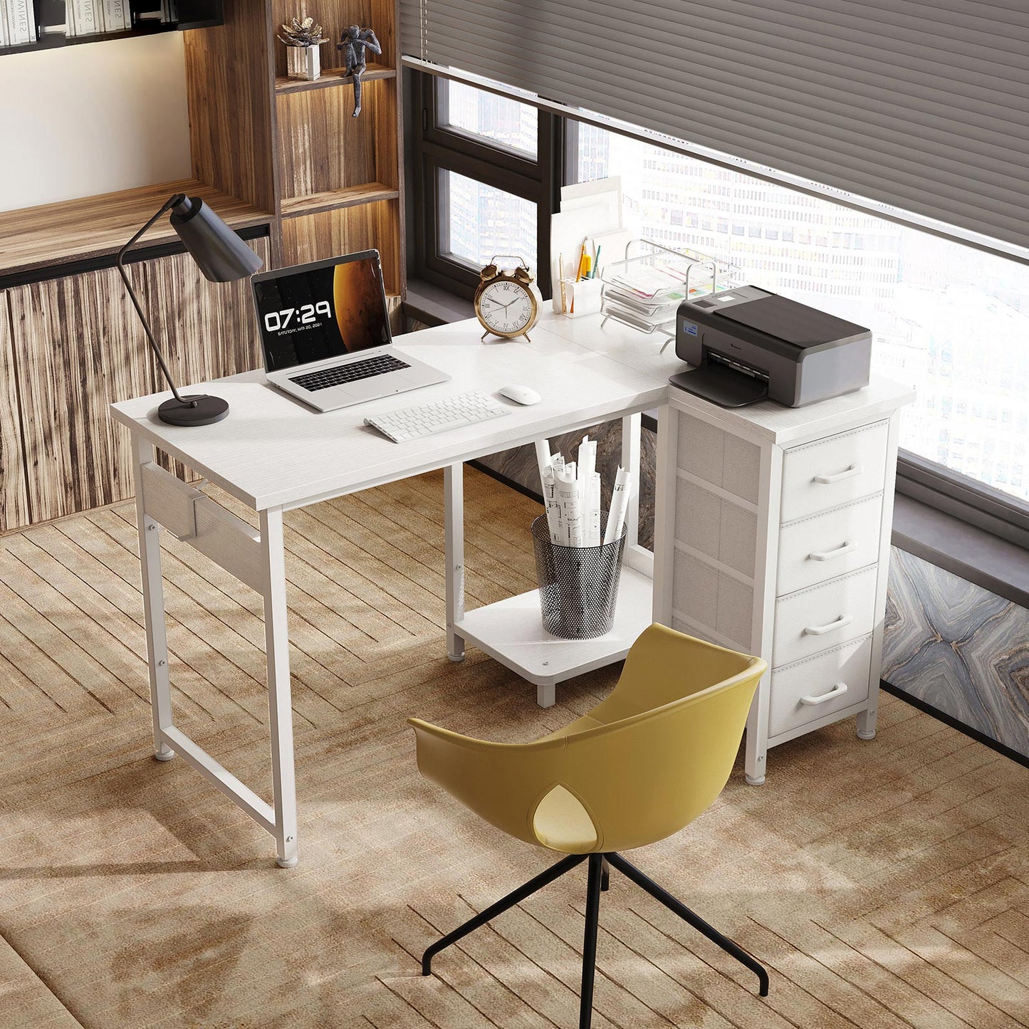 White L-shaped desk with 4 fabric drawers in a modern office corner, with printer on the drawer cabinet, laptop workspace, side pocket, and under-desk storage shelf.