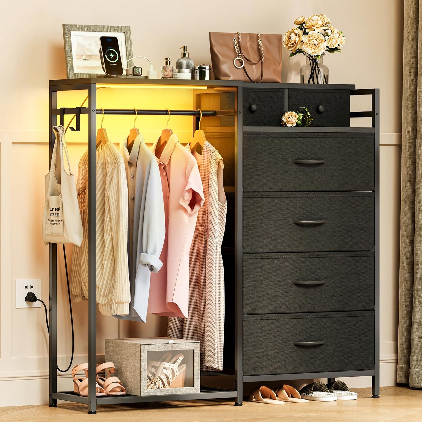 Black closet organizer storage cabinet with hanging rack, warm LED light strip, side hooks, and multi-drawer dresser design for bedroom clothing storage.