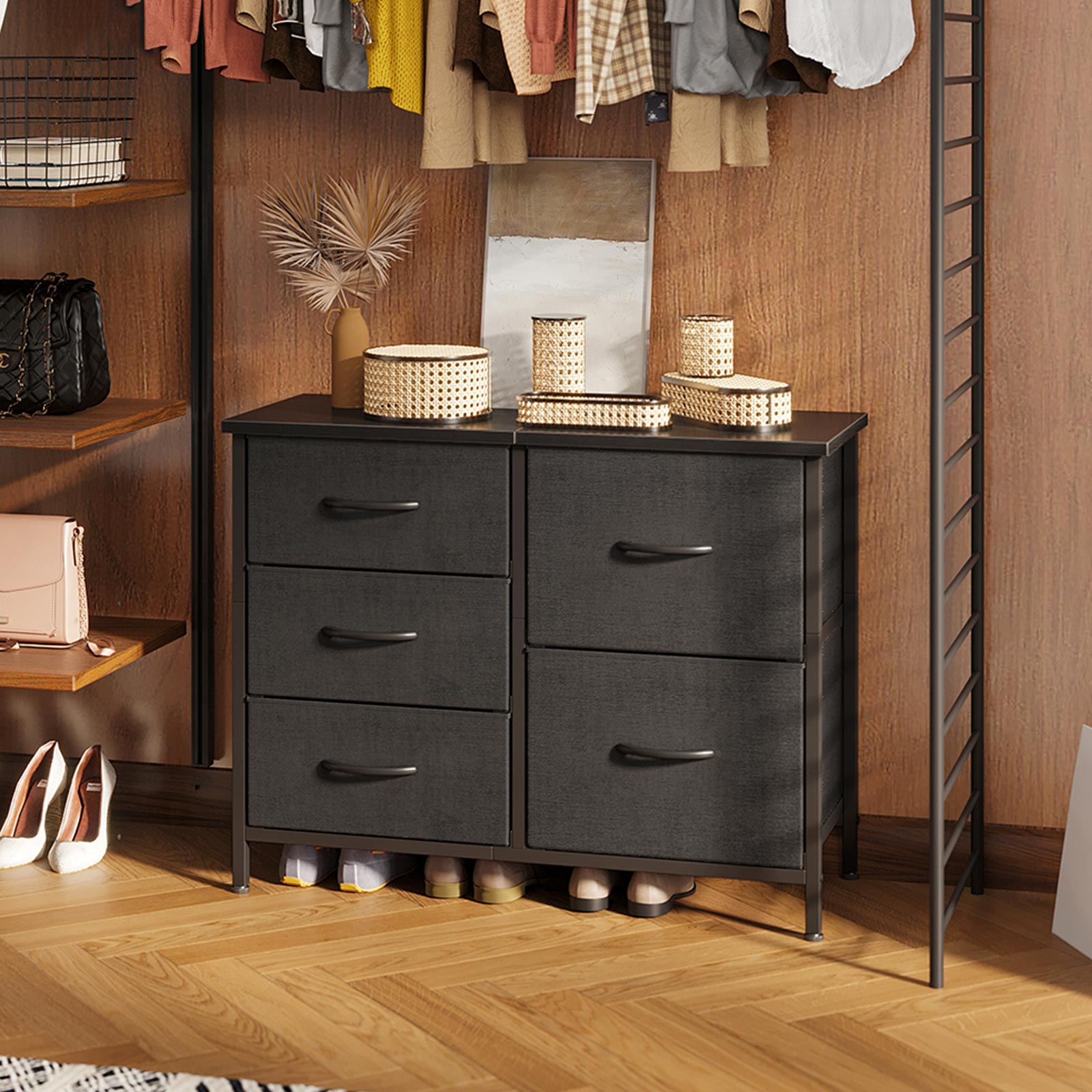 Black double-wide 3-tier 5-drawer fabric dresser with wood top and metal frame, placed in a closet under hanging clothes, used as a bedroom storage cabinet for clothing and shoes.
