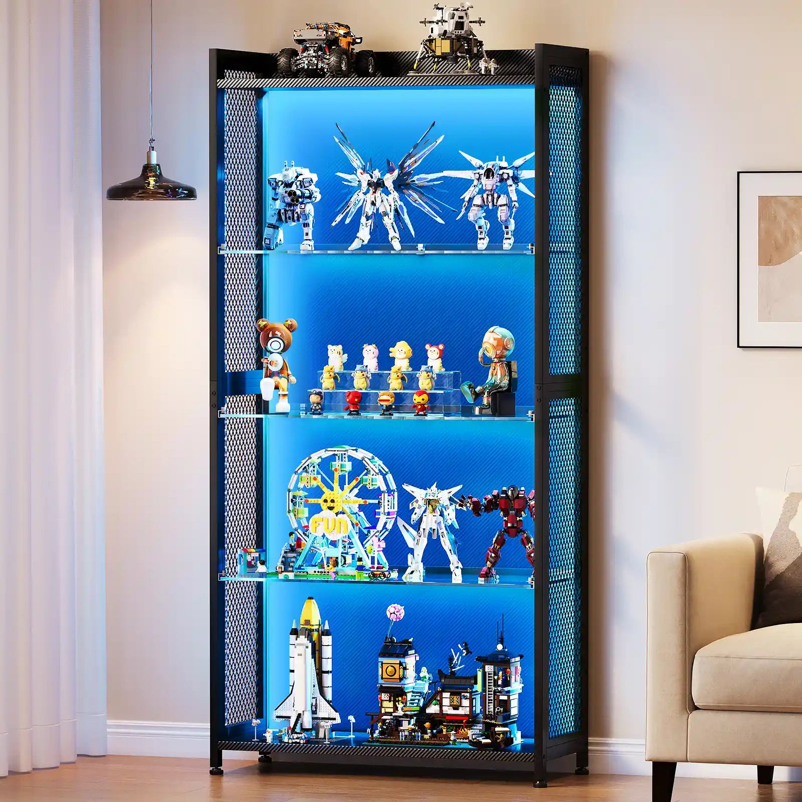 A tall black metal shelving display cabinet with four illuminated blue glass shelves, shown in a living room setting next to a beige armchair and a hanging pendant light. The shelves are filled with various toy models, action figures, and building block sets.