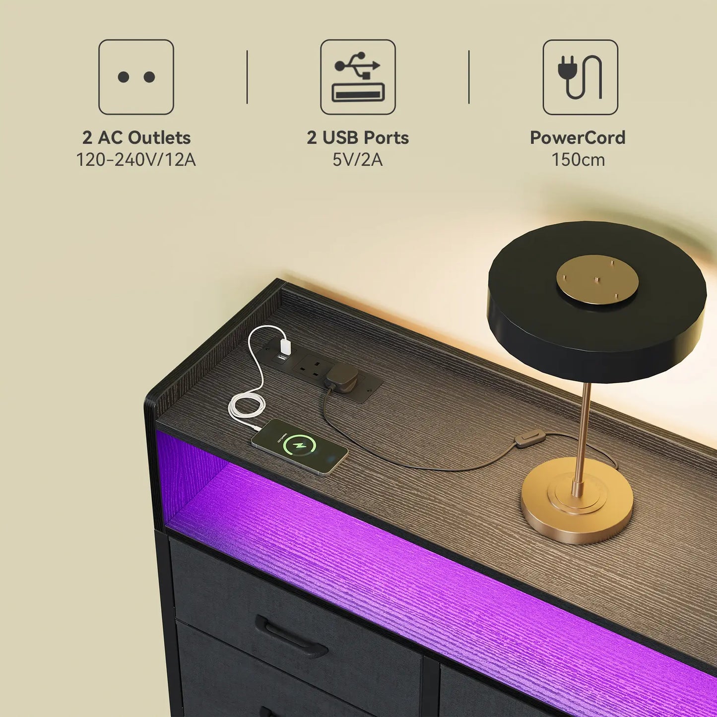 A modern black and gold table lamp sits on a dark wood nightstand with a built-in USB charging port and purple LED under-glow. The image includes feature callout icons at the top describing 2 AC outlets, 2 USB ports, and a 150cm PowerCard.