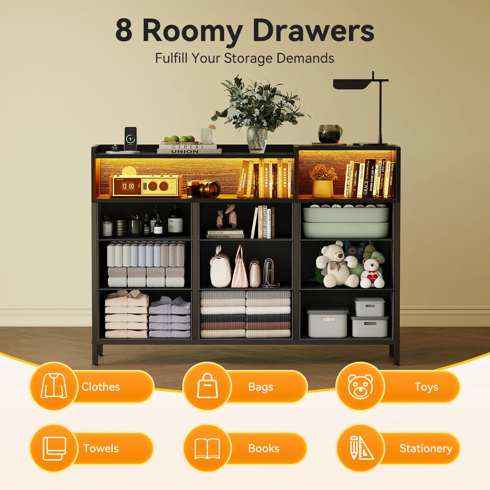 A tall black 8-drawer storage organizer cabinet with illuminated shelves, shown filled with folded towels, toiletries, books, and toys in a styled room setting. Text at the top reads '8 Roomy Drawers' and orange icons along the bottom indicate storage capacities for clothes, bags, toys, towels, books, and stationery.